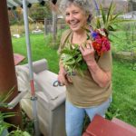Kirsten-holds-flower-bouquet-with-ginger-leaves